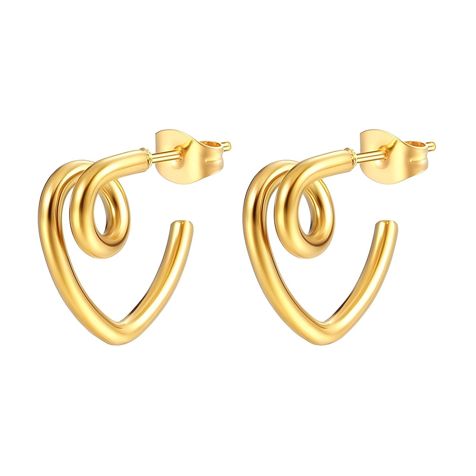 Gold hoop earrings on a textured surface