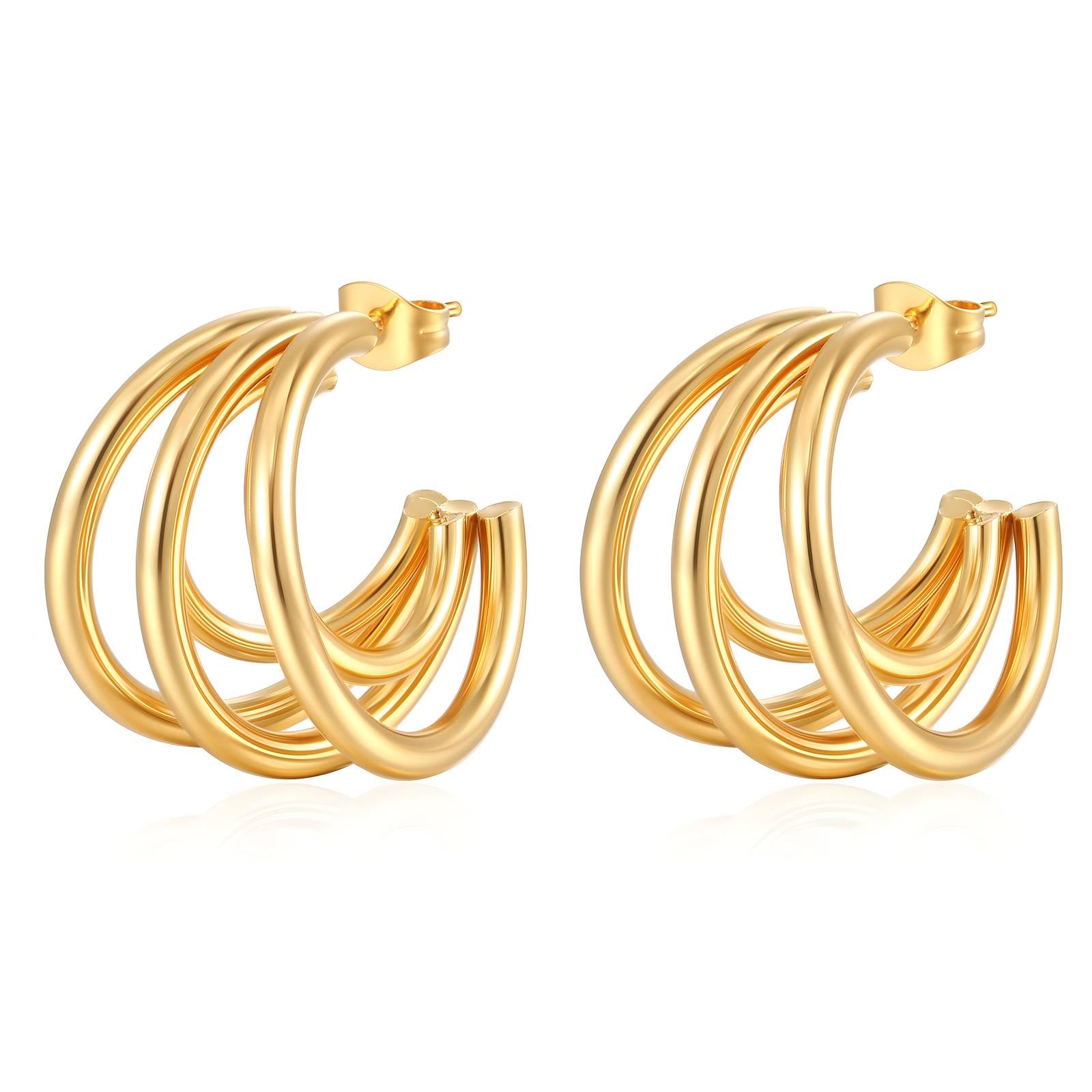 Gold hoop earrings on a white background
