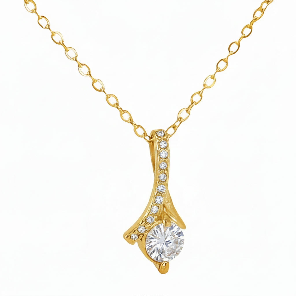 Gold necklace with a pendant on a white background