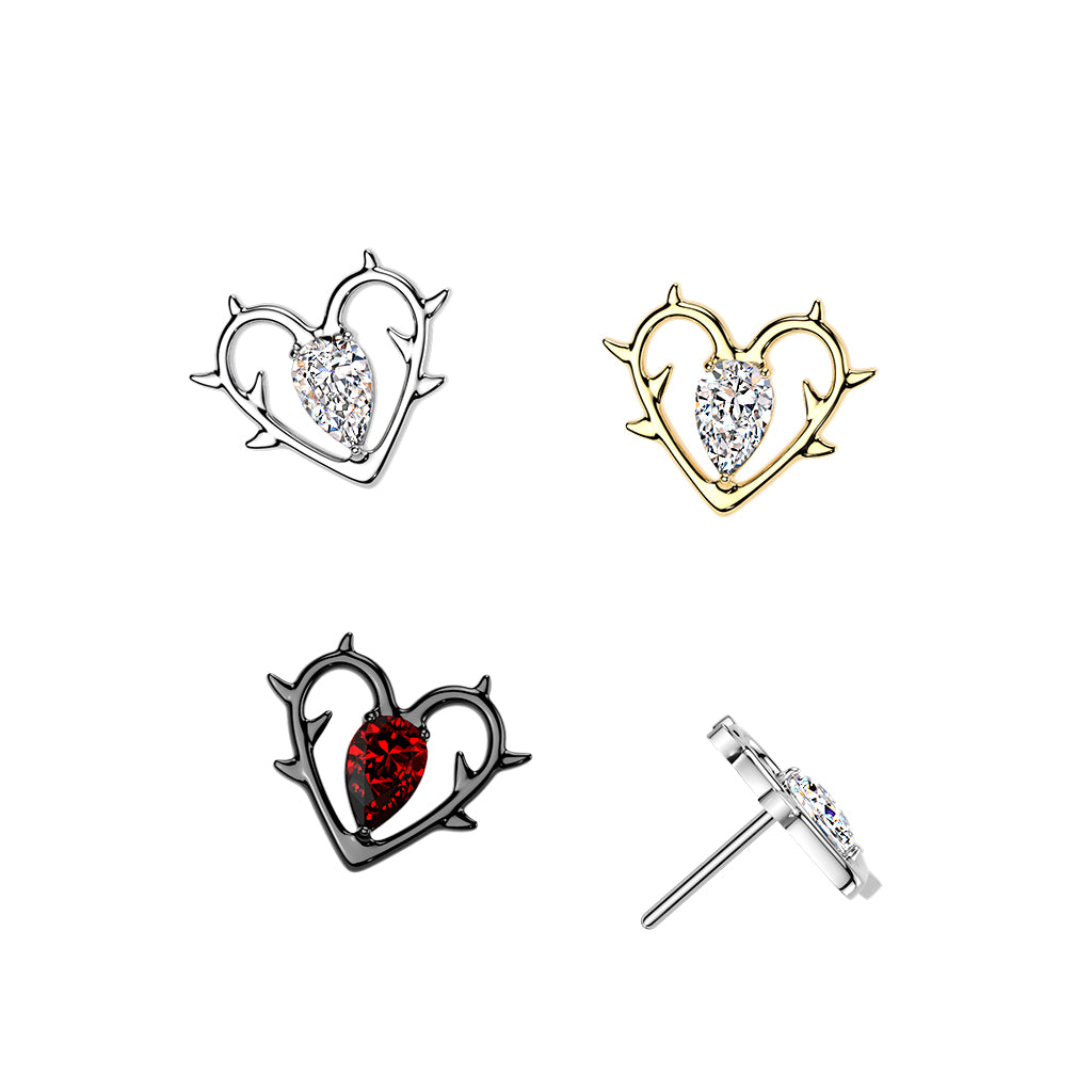 Heart-shaped earrings with embedded stones on a white background