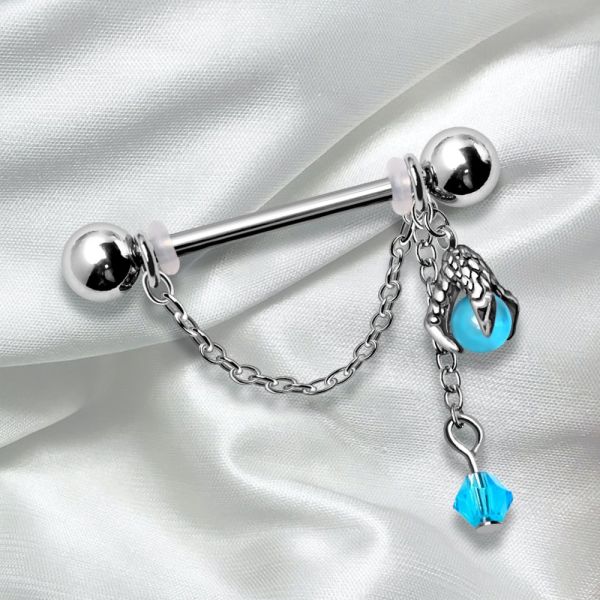 Dragon Claw Orb Nipple Cuff – 316L Stainless Steel Nipple Shield with Aqua Orb and Chained Bead on a white satin background