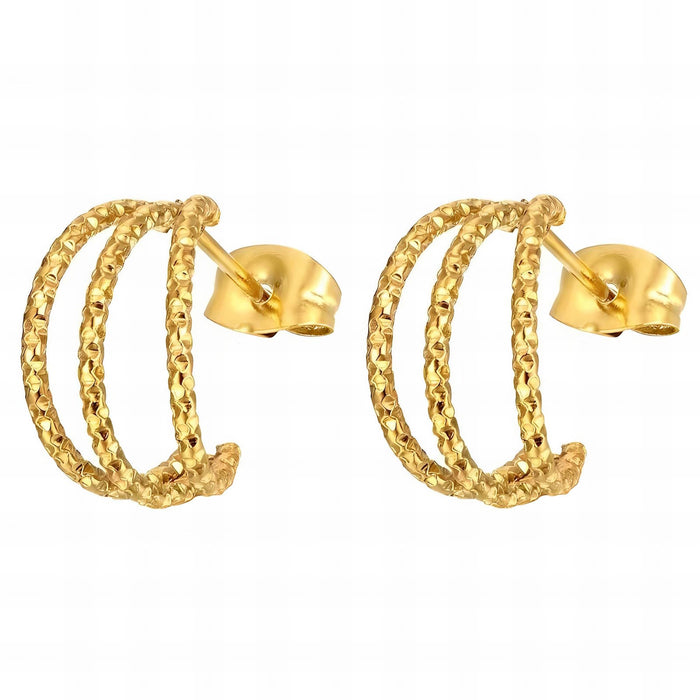 Pair of gold hammered hoop earrings on a white background