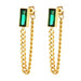 Gold chain earrings with green gemstones on a white background