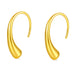 Pair of gold drop earrings on white background