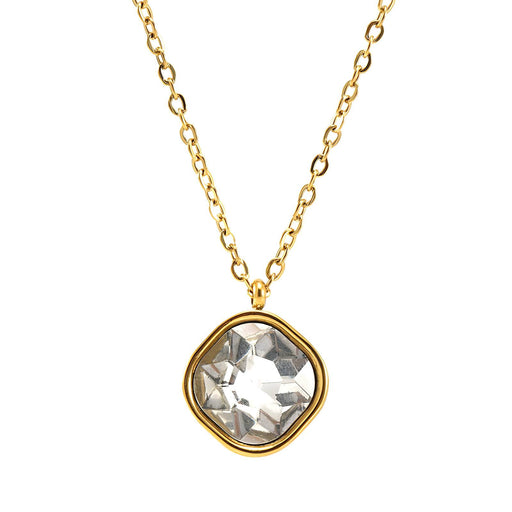 Gold necklace with a clear gemstone pendant on a white background