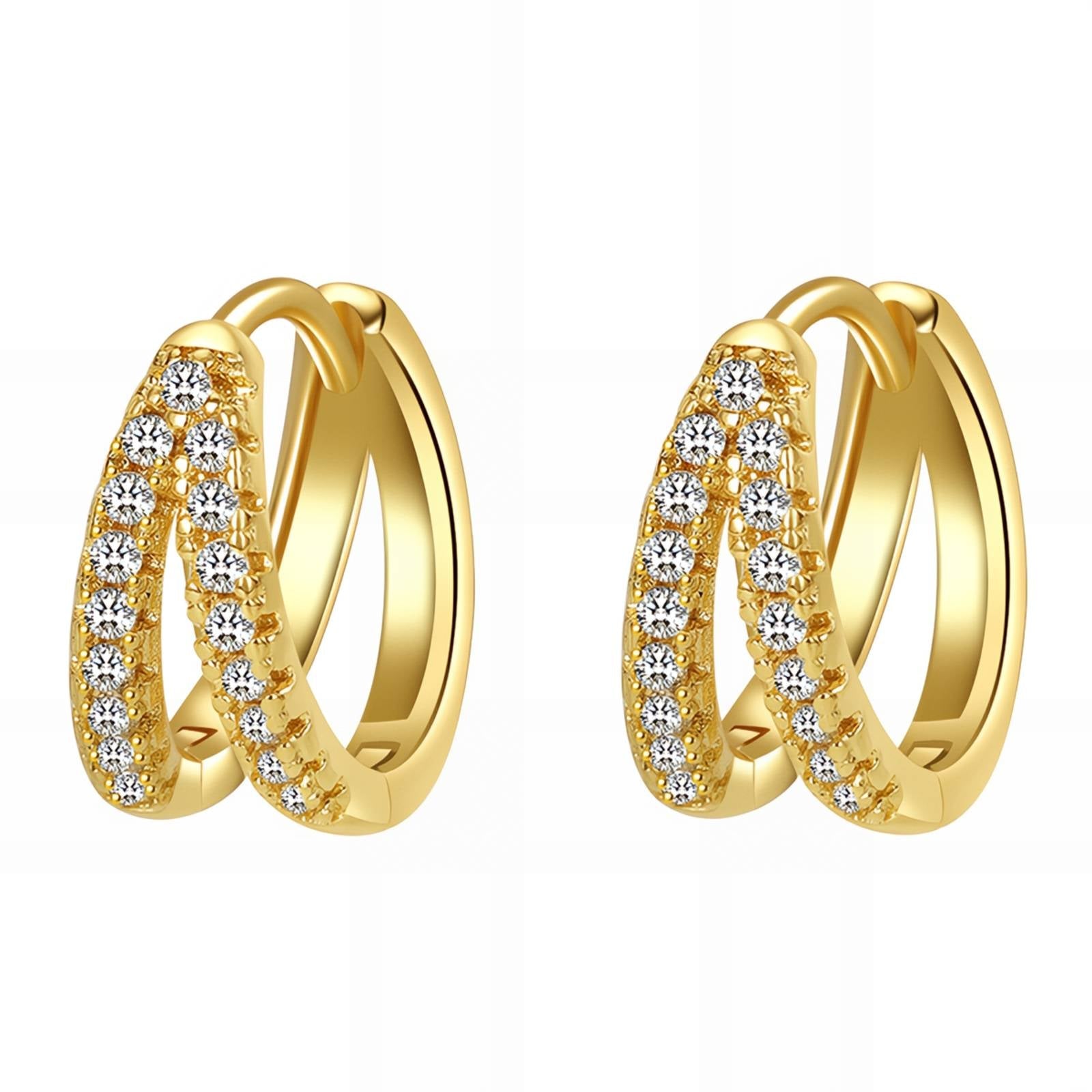 Gold hoop earrings with clear gemstones on a white background