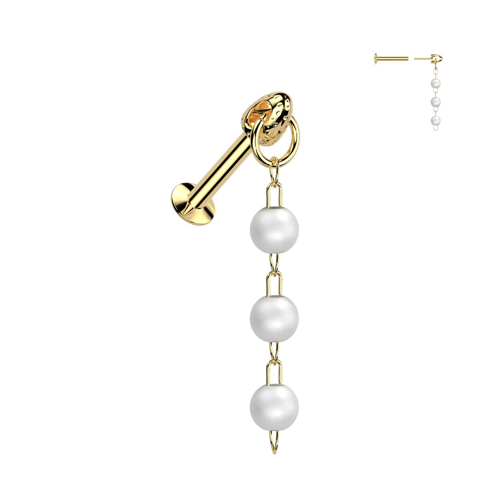 Gold earring with pearl drops on a white background