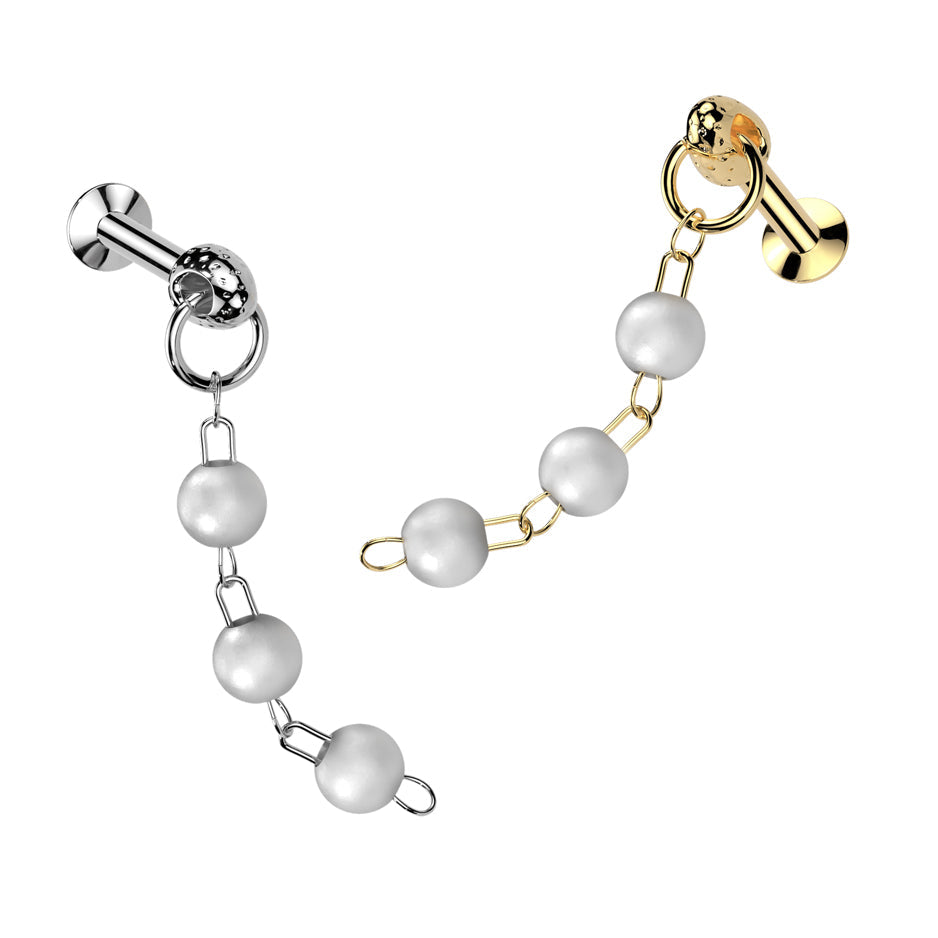 Pair of pearl earrings with gold and silver hooks on a white background