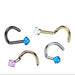 Set of nose rings with gemstones on a white background
