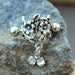 Flower Vine Cartilage Cuff – Antique Floral 316L Stainless Steel Ear Cuff with Clear CZ Drops on rock display
