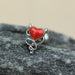 Devil Heart Cartilage Bar 16G – Red Enamel Winged Heart with Stainless Steel Tragus Bar on a stone surface