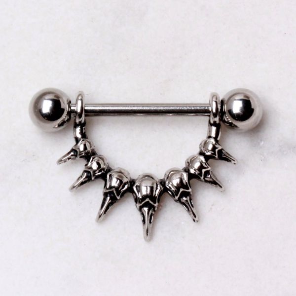 Raven Skull Nipple Dangle – 316L Stainless Steel Nipple Barbell with Dual Sculpted Skull Design on grey background