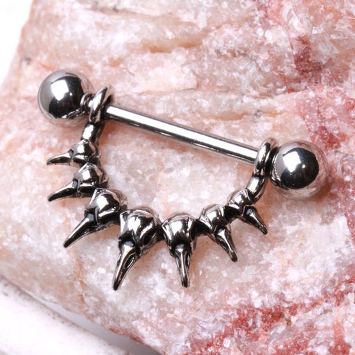 Raven Skull Nipple Dangle – 316L Stainless Steel Nipple Barbell with Dual Sculpted Skull Design on pink quartz background